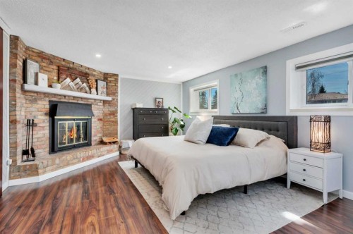 11 Pearson Crescent, Red Deer, AB - Indoor Photo Showing Bedroom With Fireplace