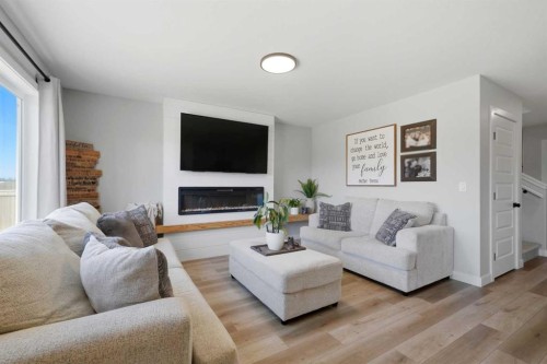 56 Trinity Street, Lacombe, AB - Indoor Photo Showing Living Room With Fireplace