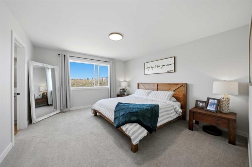 56 Trinity Street, Lacombe, AB - Indoor Photo Showing Bedroom