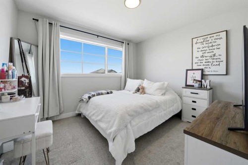 56 Trinity Street, Lacombe, AB - Indoor Photo Showing Bedroom