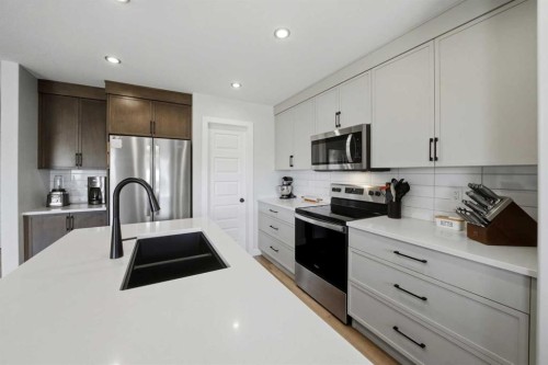 56 Trinity Street, Lacombe, AB - Indoor Photo Showing Kitchen With Stainless Steel Kitchen With Double Sink With Upgraded Kitchen