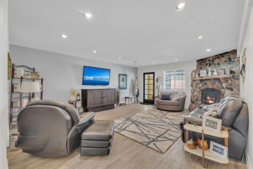 120 Devilder Avenue, Trochu, AB - Indoor Photo Showing Other Room With Fireplace