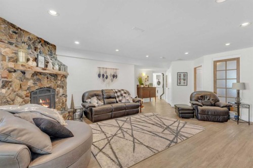120 Devilder Avenue, Trochu, AB - Indoor Photo Showing Living Room With Fireplace