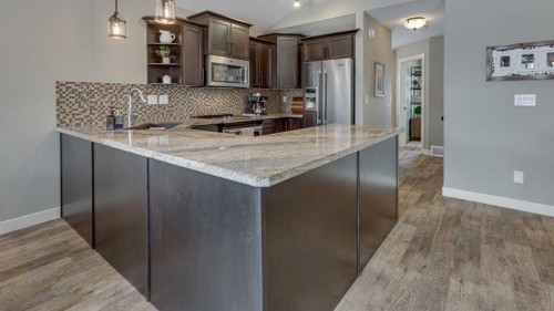 84 Isbister Close, Red Deer, AB - Indoor Photo Showing Kitchen With Stainless Steel Kitchen With Upgraded Kitchen