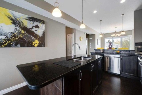 103-5210 Lakeshore Drive, Sylvan Lake, AB - Indoor Photo Showing Kitchen With Double Sink With Upgraded Kitchen