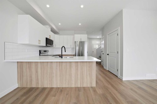 61 Pinnacle Close, Blackfalds, AB - Indoor Photo Showing Kitchen With Upgraded Kitchen