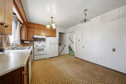 3301 41 Avenue, Red Deer, AB - Indoor Photo Showing Kitchen With Double Sink