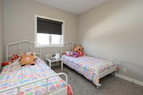 137 Coachman Way, Blackfalds, AB - Indoor Photo Showing Bedroom