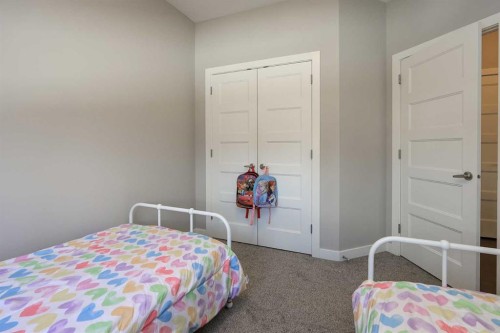137 Coachman Way, Blackfalds, AB - Indoor Photo Showing Bedroom