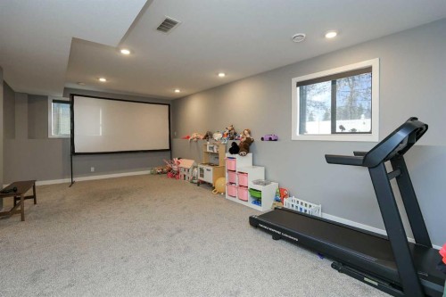 137 Coachman Way, Blackfalds, AB - Indoor Photo Showing Gym Room