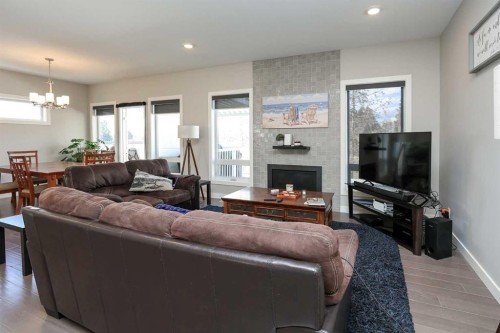 137 Coachman Way, Blackfalds, AB - Indoor Photo Showing Living Room With Fireplace