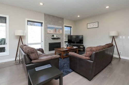 137 Coachman Way, Blackfalds, AB - Indoor Photo Showing Living Room With Fireplace