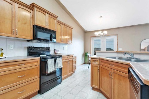 74 Fulmar Close, Sylvan Lake, AB - Indoor Photo Showing Kitchen With Double Sink