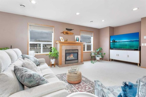 74 Fulmar Close, Sylvan Lake, AB - Indoor Photo Showing Living Room With Fireplace