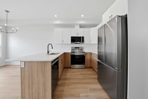 57 Pinnacle Close, Blackfalds, AB - Indoor Photo Showing Kitchen With Upgraded Kitchen