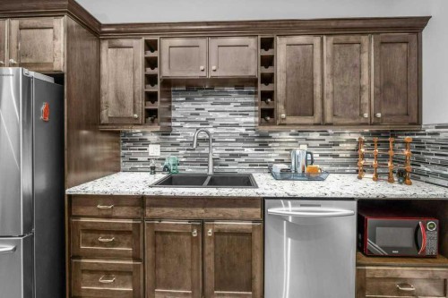 105 Connaught Crescent, Red Deer, AB - Indoor Photo Showing Kitchen With Stainless Steel Kitchen With Double Sink With Upgraded Kitchen