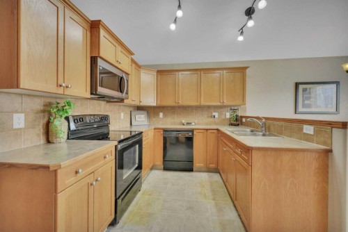 628 Lancaster Drive, Red Deer, AB - Indoor Photo Showing Kitchen With Double Sink