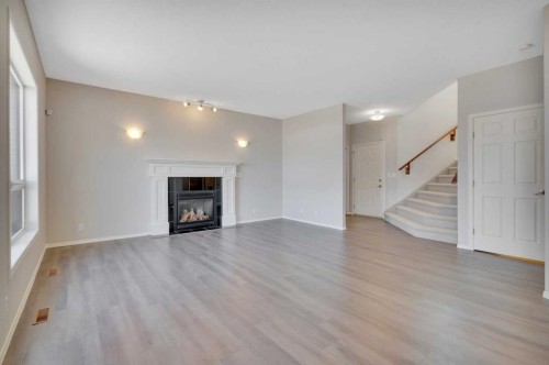 19 Lang Close, Red Deer, AB - Indoor Photo Showing Living Room With Fireplace