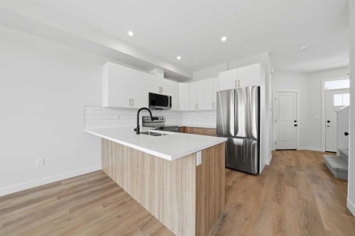 81 Pinnacle Close, Blackfalds, AB - Indoor Photo Showing Kitchen With Double Sink
