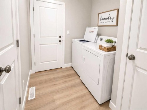 4438 Van Eaton Way, Clive, AB - Indoor Photo Showing Laundry Room
