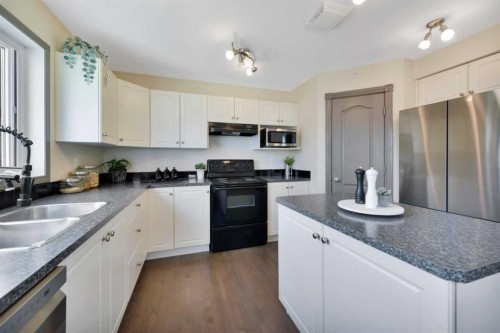 93 White Avenue, Red Deer, AB - Indoor Photo Showing Kitchen With Double Sink