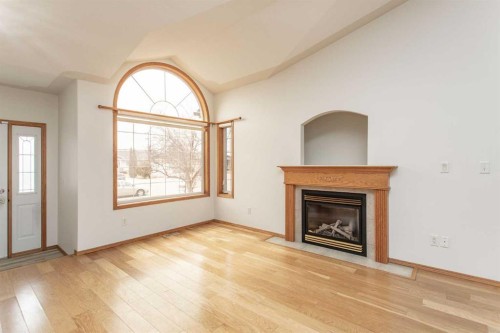 48 Duval Close, Red Deer, AB - Indoor Photo Showing Living Room With Fireplace