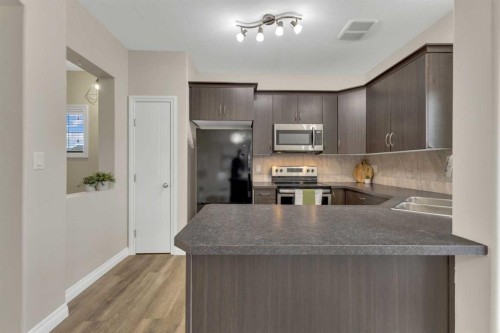 9 Ross Close, Sylvan Lake, AB - Indoor Photo Showing Kitchen With Double Sink With Upgraded Kitchen