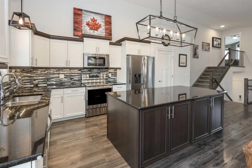 117 Coachman Way, Blackfalds, AB - Indoor Photo Showing Kitchen With Double Sink With Upgraded Kitchen