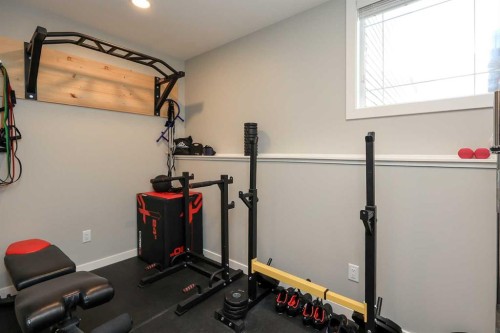 117 Coachman Way, Blackfalds, AB - Indoor Photo Showing Gym Room