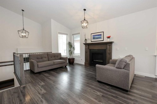 117 Coachman Way, Blackfalds, AB - Indoor Photo Showing Living Room With Fireplace