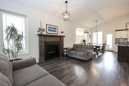 117 Coachman Way, Blackfalds, AB - Indoor Photo Showing Living Room With Fireplace