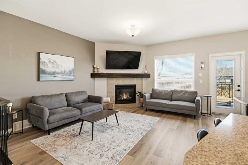 12 Cyprus Road, Blackfalds, AB - Indoor Photo Showing Living Room With Fireplace