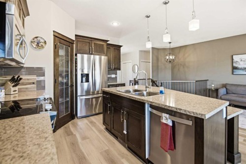 12 Cyprus Road, Blackfalds, AB - Indoor Photo Showing Kitchen With Stainless Steel Kitchen With Double Sink With Upgraded Kitchen