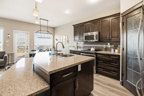 12 Cyprus Road, Blackfalds, AB - Indoor Photo Showing Kitchen With Double Sink With Upgraded Kitchen