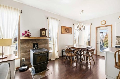 57 Woodbine Close, Blackfalds, AB - Indoor Photo Showing Dining Room With Fireplace