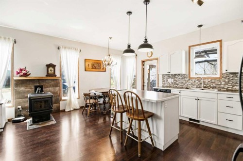 57 Woodbine Close, Blackfalds, AB - Indoor Photo Showing Kitchen With Fireplace With Upgraded Kitchen