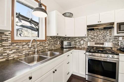 57 Woodbine Close, Blackfalds, AB - Indoor Photo Showing Kitchen With Double Sink With Upgraded Kitchen