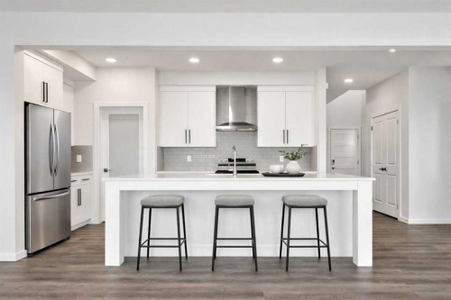 8 Heritage Link, Cochrane, AB - Indoor Photo Showing Kitchen With Upgraded Kitchen