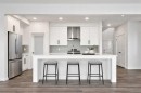 8 Heritage Link, Cochrane, AB  - Indoor Photo Showing Kitchen With Upgraded Kitchen 