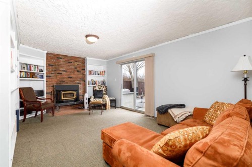 27 Wallace Close, Red Deer, AB - Indoor Photo Showing Living Room With Fireplace