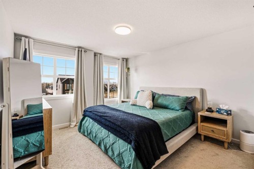 8 Springfield Boulevard, Sylvan Lake, AB - Indoor Photo Showing Bedroom