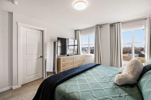 8 Springfield Boulevard, Sylvan Lake, AB - Indoor Photo Showing Bedroom