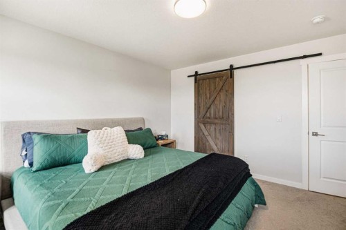 8 Springfield Boulevard, Sylvan Lake, AB - Indoor Photo Showing Bedroom