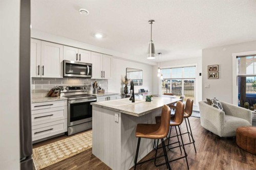 8 Springfield Boulevard, Sylvan Lake, AB - Indoor Photo Showing Kitchen With Double Sink With Upgraded Kitchen