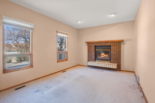 36 Muldrew Crescent, Red Deer, AB - Indoor Photo Showing Living Room With Fireplace