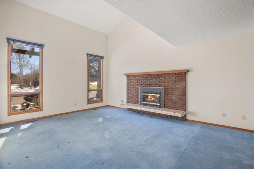 36 Muldrew Crescent, Red Deer, AB - Indoor Photo Showing Living Room With Fireplace