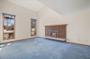 36 Muldrew Crescent, Red Deer, AB  - Indoor Photo Showing Living Room With Fireplace 