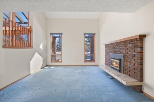 36 Muldrew Crescent, Red Deer, AB - Indoor Photo Showing Other Room With Fireplace