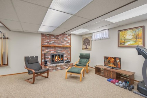 3510 43A Avenue, Red Deer, AB - Indoor Photo Showing Basement With Fireplace