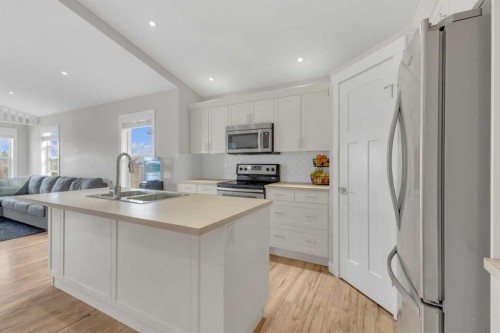 105 Ash Close, Blackfalds, AB - Indoor Photo Showing Kitchen With Double Sink